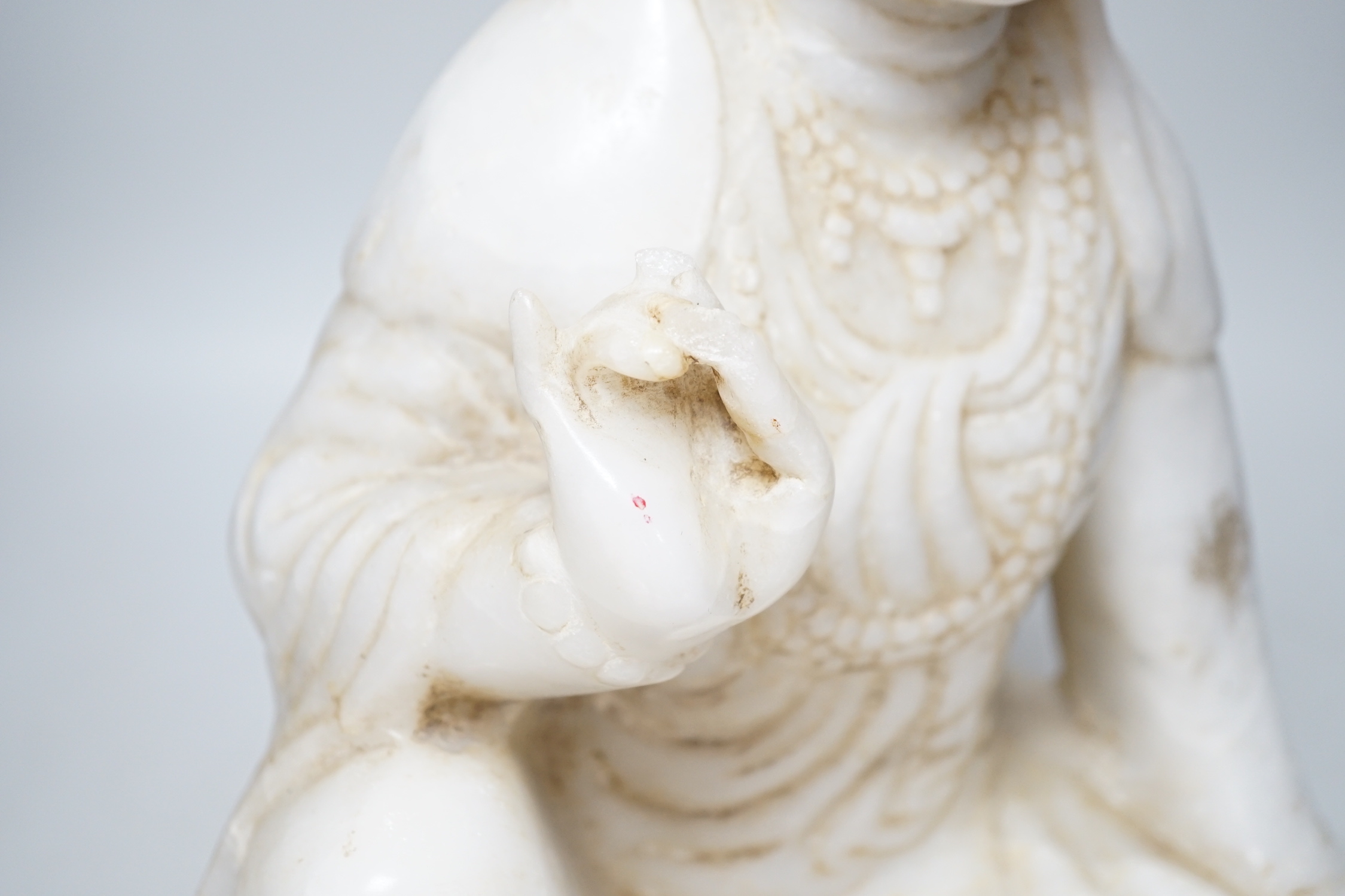 A Chinese carved marble figure of Guanyin, 42cm high